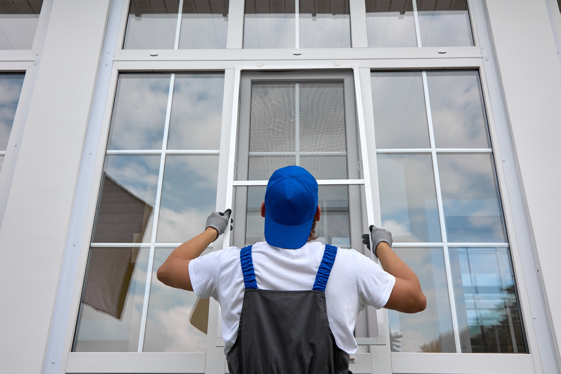 Professional installation of protective nets against insects on plastic windows